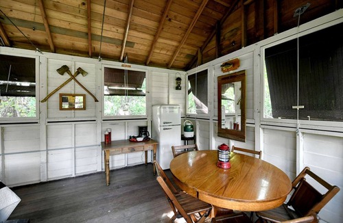 East Troy Cabin | Three Cozy Historic Scout Cabins with Fire Pit, BBQ, and Hammocks for a Memorable Family Adventure in Troy, Wisconsin