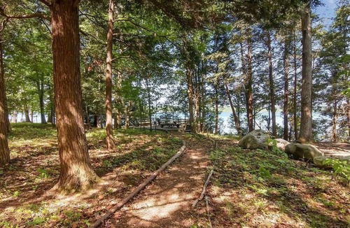 Alden Cottage | Torch lake waterfront:100 ft of sandy beach, 3-bedroom, 3-bath cottage