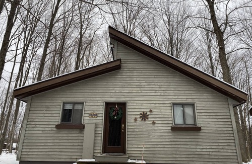 Thompsonville House | Up-north wood cabin, steps from river, 1 mile to Crystal Mtn Resort, free wifi.