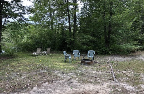 Petoskey Cabin | very private,adorable rustic cabin -out house , full shower house off barn