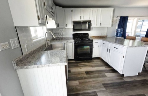 Solon Mills Cottage | Waterfront 2BR Nautical Cottage on Grass Lake - Hot Tub, Firepit & Year-Round Fun