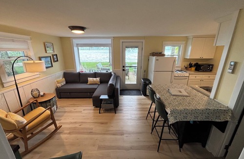Traverse City Cottage | Waterfront directly on Lake Leelanau!Cottage with beach and fire pits!