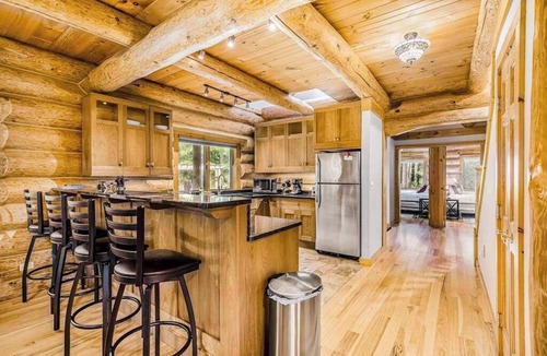 Thompsonville House | Waterfront home on Betsie River with hot tub & sauna near skiing at Crystal Mtn
