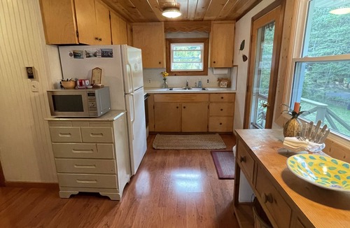 Lake Leelanau Cottage | Waterfront, peaceful, cozy, cottage w/dock amazing sunsets, kayaks,3 bed/2 bath.
