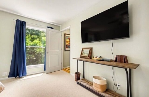 Michigan City House | Welcome to Lake Breeze Cottage near Lake Michigan! This 2-bedroom, 2-bath home offers a king and queen bedroom, sofa couch, open-concept living space, and a private back patio for guest enjoyment.