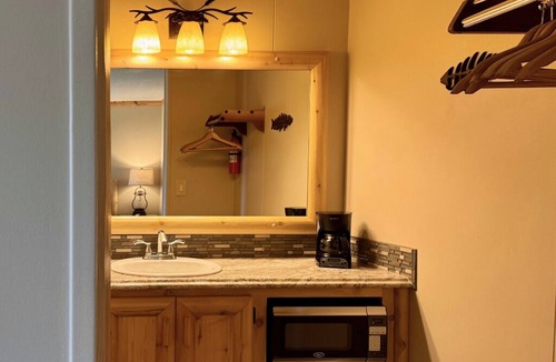 Trout Lake Hotel | Welcoming King Room #6 with AC at lakefront Twin Cedars Resort in Trout Lake MI