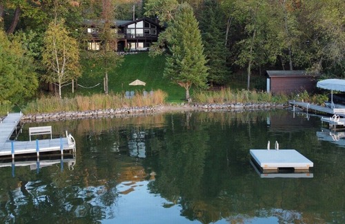 Whitewater House | Whitewater Lakefront Lodge with 200 Feet Shoreline Docks Sunset Views