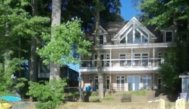 Beautiful lakefront home perfect for family reunions: great swimming, game room.