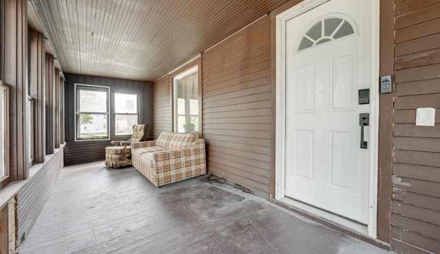 Centrally Located Albion Home with Screened Porch!