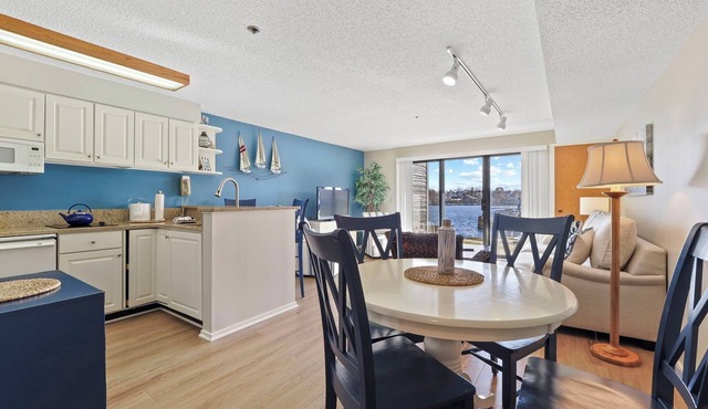 Edgewater Inn Condo #117D with Waterfront Access | Pool, Hot Tub, Sauna