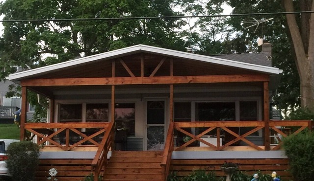 Enjoy the view from relaxing deck overlooking the lake. Water fun and sun.