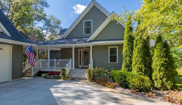 "Home Away From Home" nestled into five private acres on an all sports lake!