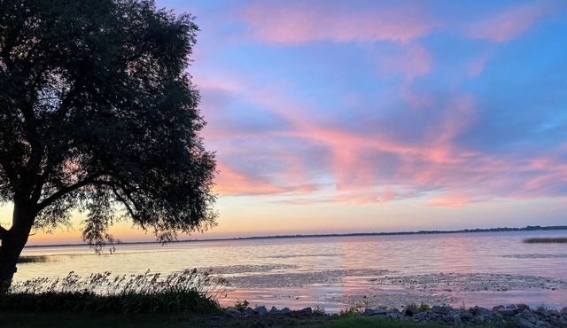 Home with panoramic lake views of Lake Poygan