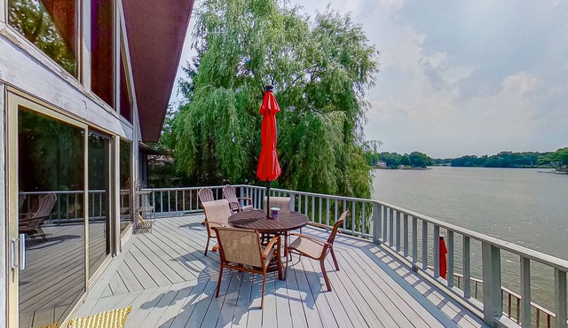 Lakefront home with spacious decks, lake views, hot tub, gas grill, & W/D