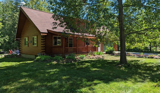Log Cabin home on the Sturgeon River in Indian River