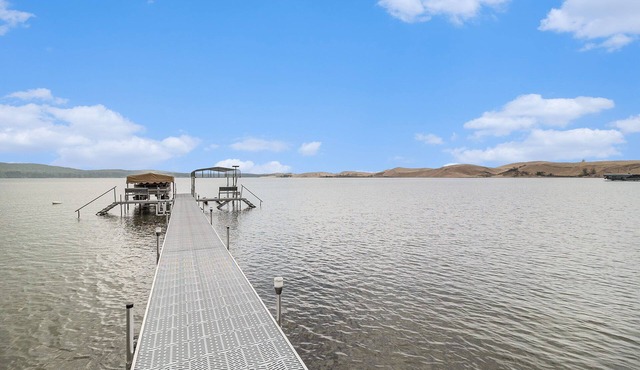 NEW LISTING: Beautiful cottage on the shores of Silver Lake with stunning water & dune views.