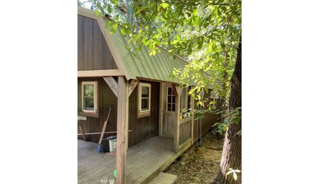 PINE TREE CABIN Cute cabin nestled in the woods.
