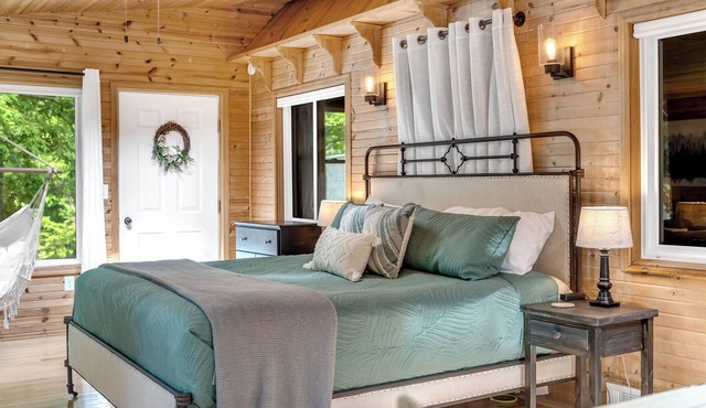 Quiet, private and wooded waterfront on a huge lot. King beds. Boats included!
