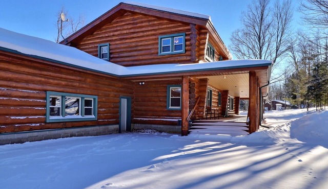 Scandinavian hand-scribed full log home on 31 acres and a quiet lake and trails