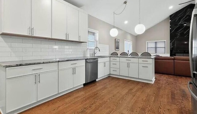Spacious Riverfront Retreat With Wraparound Porch And Room For The Whole Team