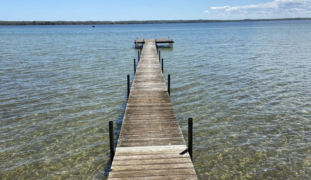 Sunrise on Mullett Lake, 115' Lakefront sandy bottom, private dock, new remodel