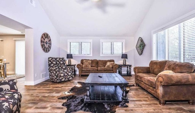 Updated, tree-lined home on the snowmobile trail with gas fireplace & firepit
