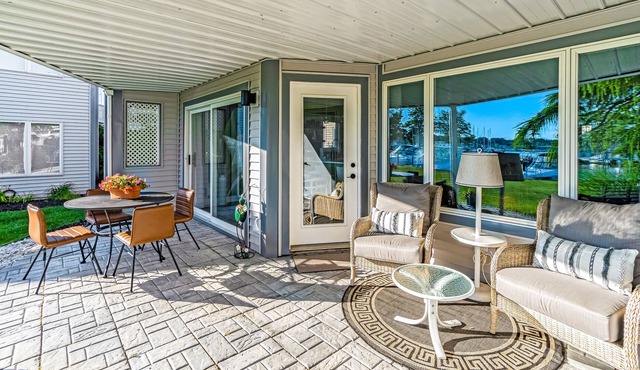 Water-view condo with private furnished patio, electric fireplace, W/D, and AC