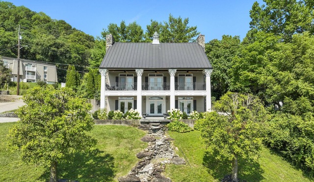 Welcome to the Banks of Aurora - A Charming River View Home in Downtown Aurora