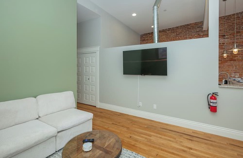 Central Business District Apartment | Downtown Luxury Loft, 13-Ft Ceilings, Walkable